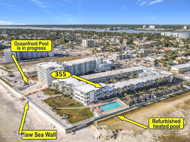 bird's eye view featuring a view of city and a water view