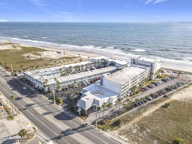 bird's eye view featuring a water view and a view of the beach