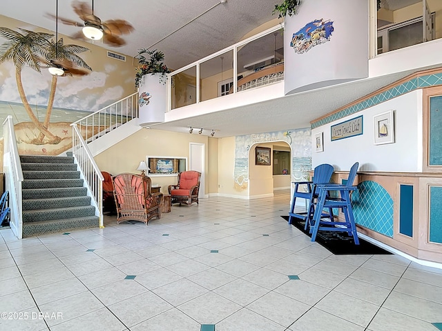 building lobby featuring visible vents and stairs