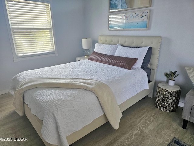 bedroom featuring wood finished floors