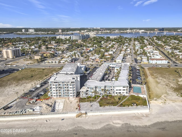 birds eye view of property featuring a water view and a view of city