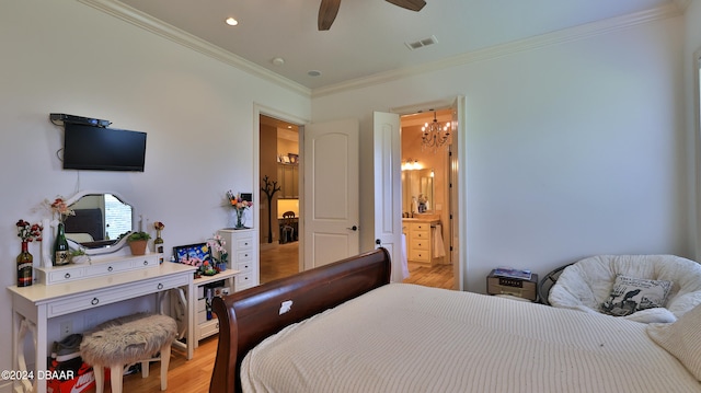 bedroom with ensuite bath, light hardwood / wood-style flooring, ceiling fan with notable chandelier, and ornamental molding