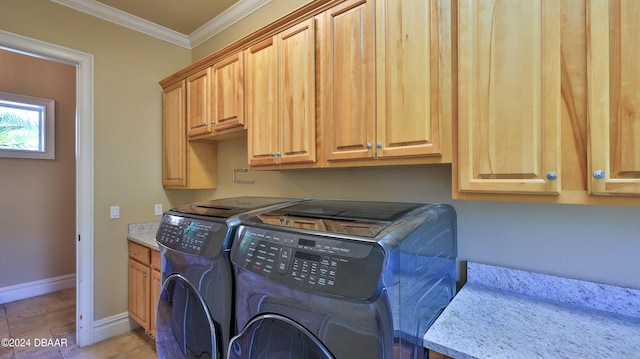 laundry room with light tile patterned flooring, cabinets, ornamental molding, and washing machine and clothes dryer