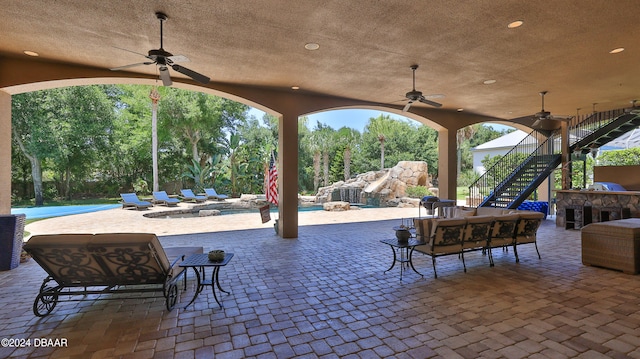 view of patio with ceiling fan