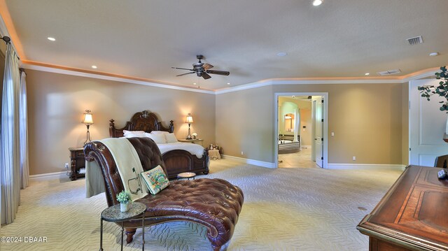 carpeted bedroom featuring ceiling fan and crown molding