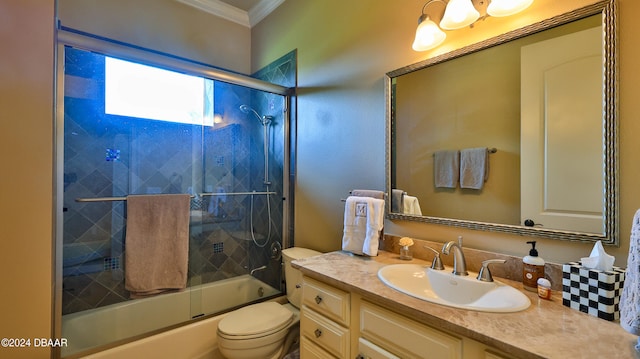 full bathroom featuring crown molding, vanity, bath / shower combo with glass door, and toilet