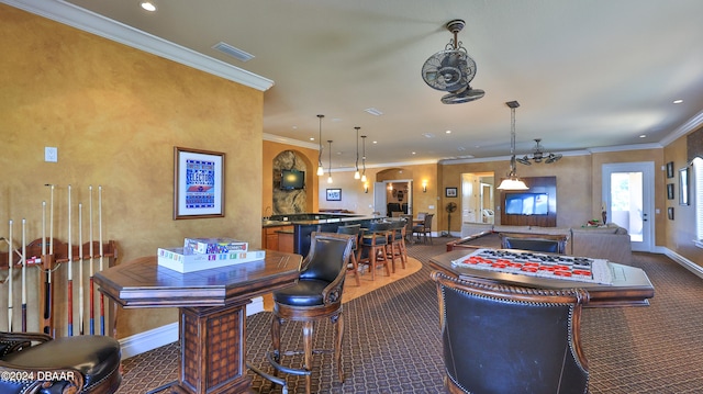 carpeted dining space featuring crown molding