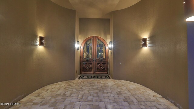 tiled entryway featuring french doors