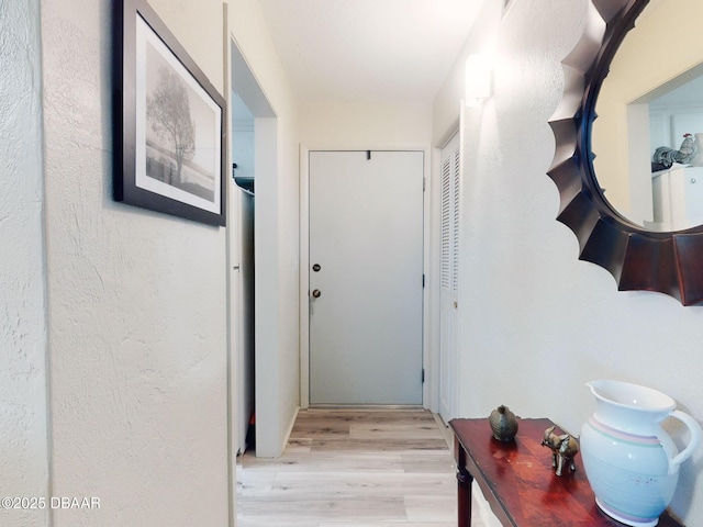 hall featuring light wood-style flooring