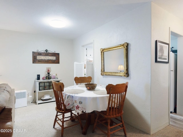 view of carpeted dining room
