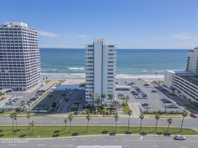 birds eye view of property featuring a water view and a view of the beach