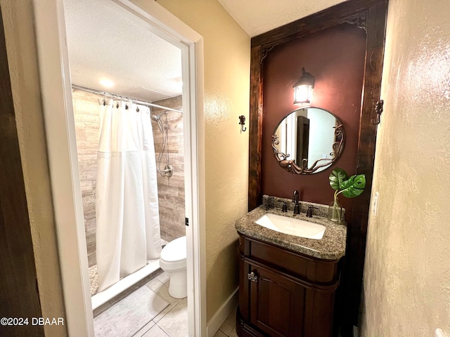 bathroom featuring toilet, tile patterned floors, curtained shower, a textured ceiling, and vanity