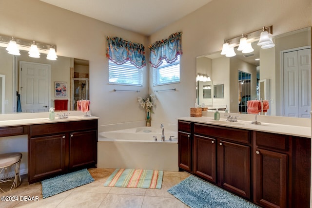 bathroom with tile patterned flooring, vanity, and plus walk in shower