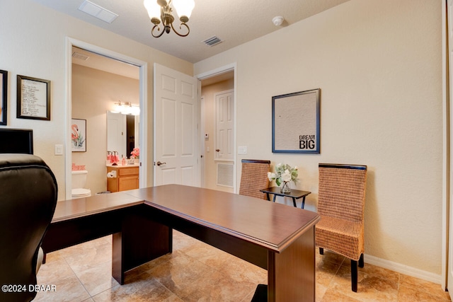 office featuring an inviting chandelier and light tile patterned floors