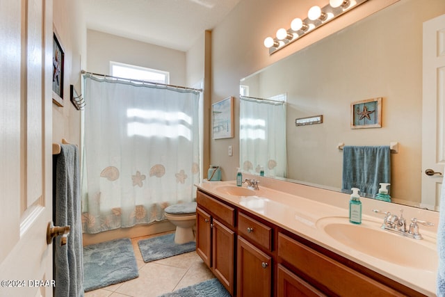 full bathroom with tile patterned flooring, vanity, shower / bath combo with shower curtain, and toilet