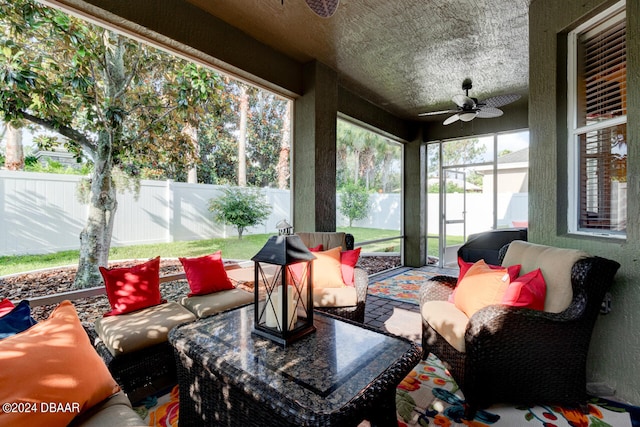 sunroom / solarium with ceiling fan