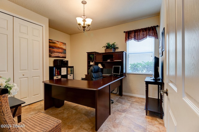 office space with an inviting chandelier