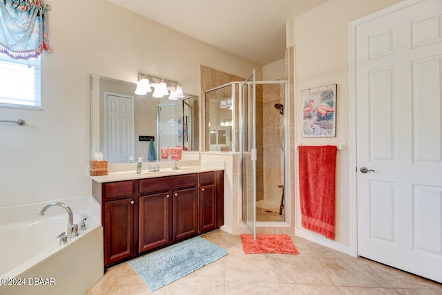 bathroom featuring independent shower and bath, tile patterned flooring, and vanity