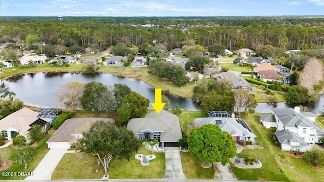 birds eye view of property featuring a residential view and a water view