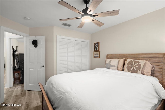 1589 Town Park Dr, Port Orange, FL 32129 - bedroom featuring a closet, ceiling fan, and light hardwood / wood-style flooring