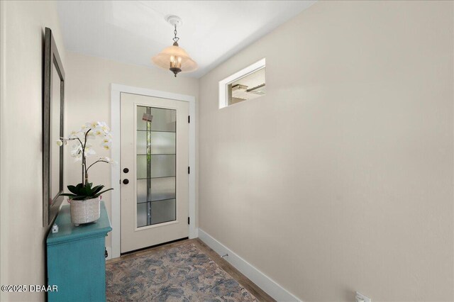 1589 Town Park Dr, Port Orange, FL 32129 - doorway to outside featuring dark wood-type flooring
