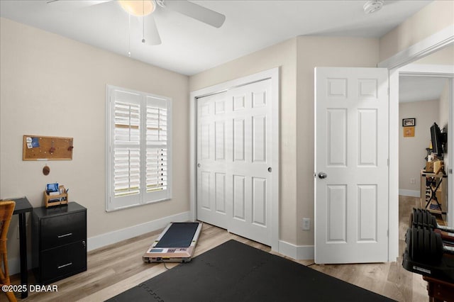 1589 Town Park Dr, Port Orange, FL 32129 - exercise area featuring ceiling fan and light hardwood / wood-style floors