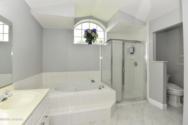 full bathroom with a shower stall, toilet, a garden tub, vaulted ceiling, and vanity