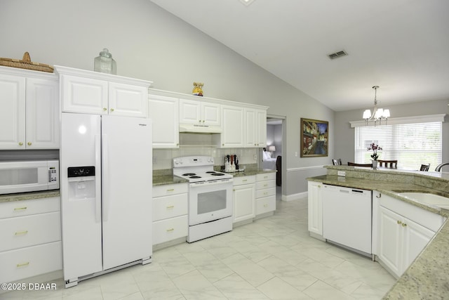 kitchen with white cabinetry, white appliances, visible vents, and a sink