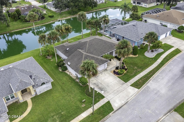 aerial view featuring a residential view and a water view