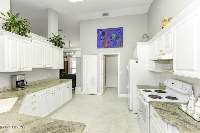 kitchen featuring white appliances, light stone countertops, under cabinet range hood, white cabinetry, and marble finish floor