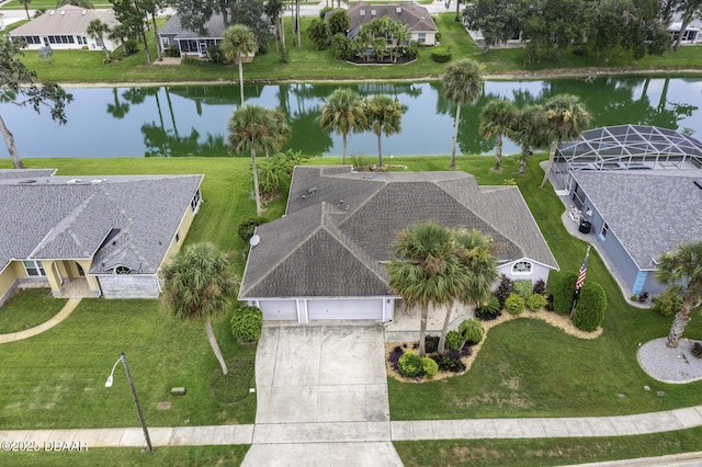 drone / aerial view with a residential view and a water view