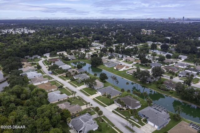 drone / aerial view with a residential view and a water view