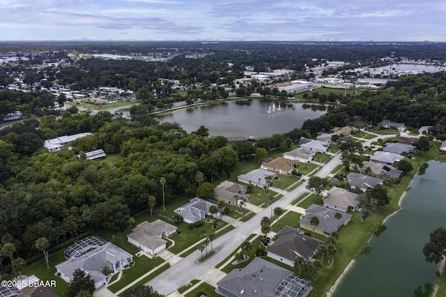 drone / aerial view with a residential view and a water view