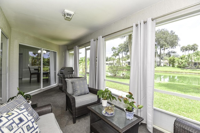 sunroom with a water view