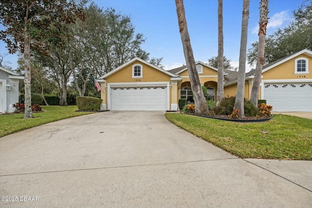 single story home with a front yard and a garage