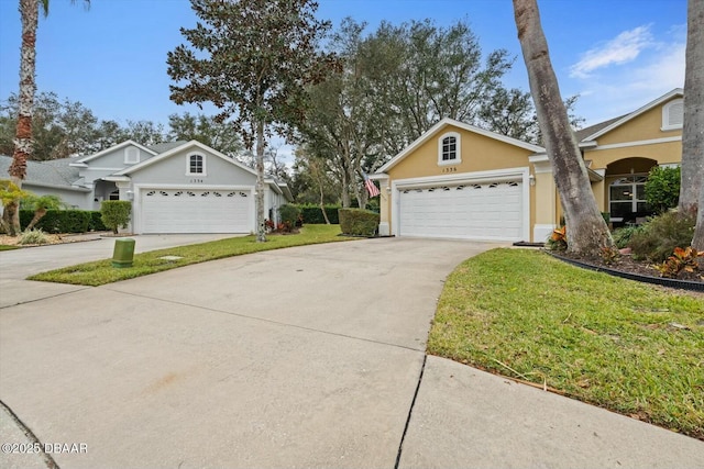 view of front of property featuring a front lawn and a garage