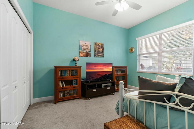 bedroom with carpet, a closet, and ceiling fan