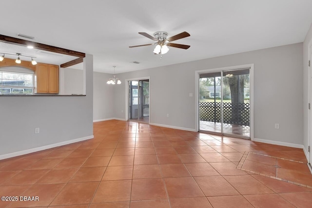 spare room featuring light tile patterned floors, visible vents, and a healthy amount of sunlight