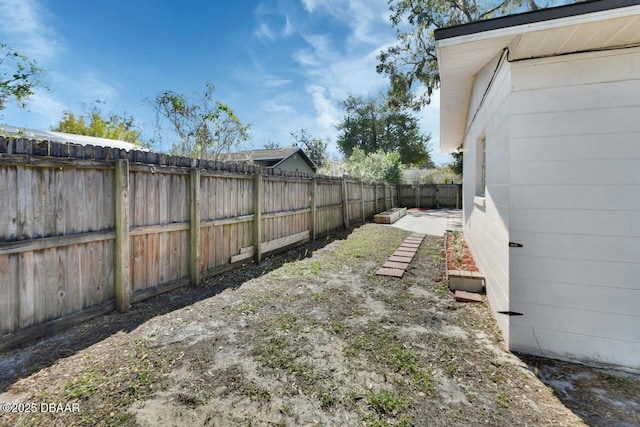 view of yard with a fenced backyard