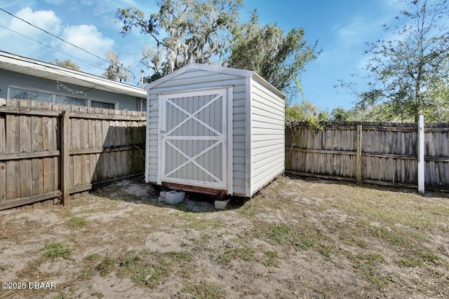 view of shed featuring a fenced backyard