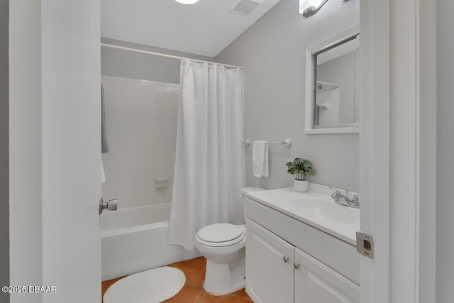 bathroom featuring tile patterned flooring, toilet, vanity, visible vents, and shower / bath combo with shower curtain