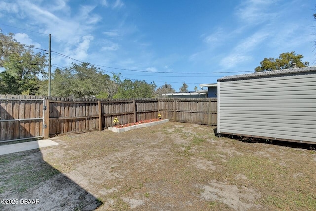 view of yard with a fenced backyard