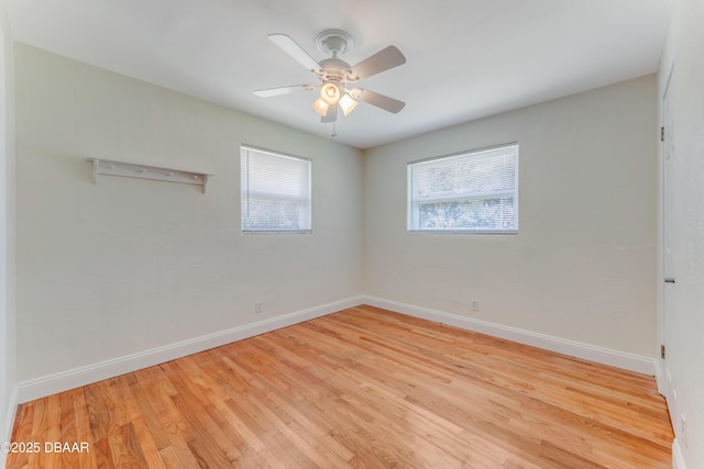 556 N Beach St, Ormond Beach, FL 32174 - empty room featuring baseboards, wood finished floors, and a ceiling fan