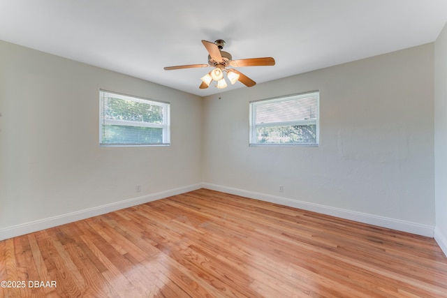 556 N Beach St, Ormond Beach, FL 32174 - empty room with plenty of natural light, light wood-type flooring, baseboards, and a ceiling fan