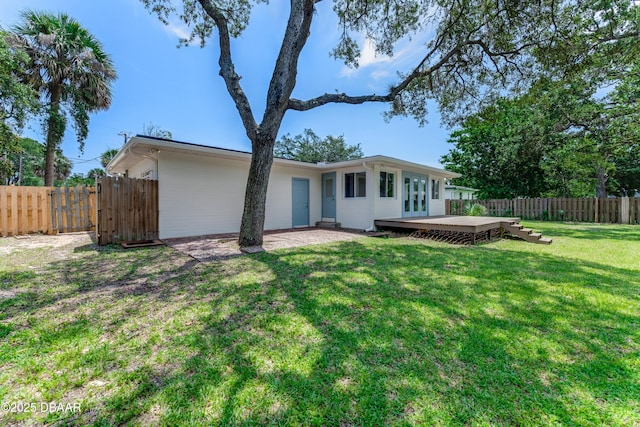 556 N Beach St, Ormond Beach, FL 32174 - rear view of property with a deck