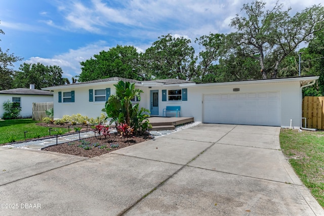 556 N Beach St, Ormond Beach, FL 32174 - ranch-style house featuring concrete driveway and an attached garage