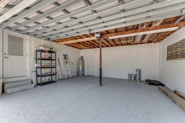 556 N Beach St, Ormond Beach, FL 32174 - garage featuring electric water heater and a garage door opener
