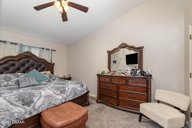 bedroom featuring a textured ceiling, ceiling fan, light colored carpet, and lofted ceiling