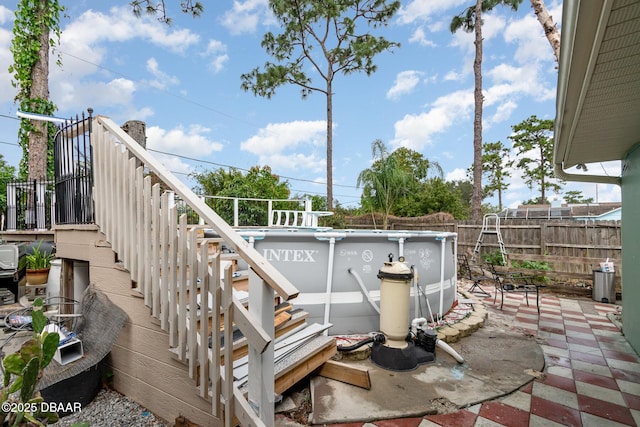 view of patio / terrace with a fenced in pool