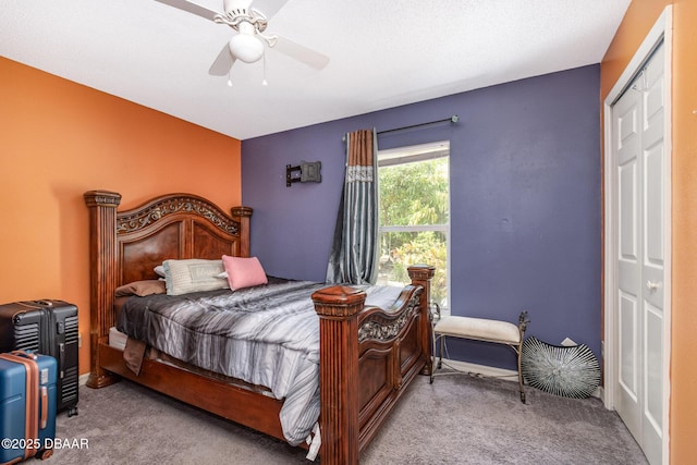 carpeted bedroom with a closet and ceiling fan